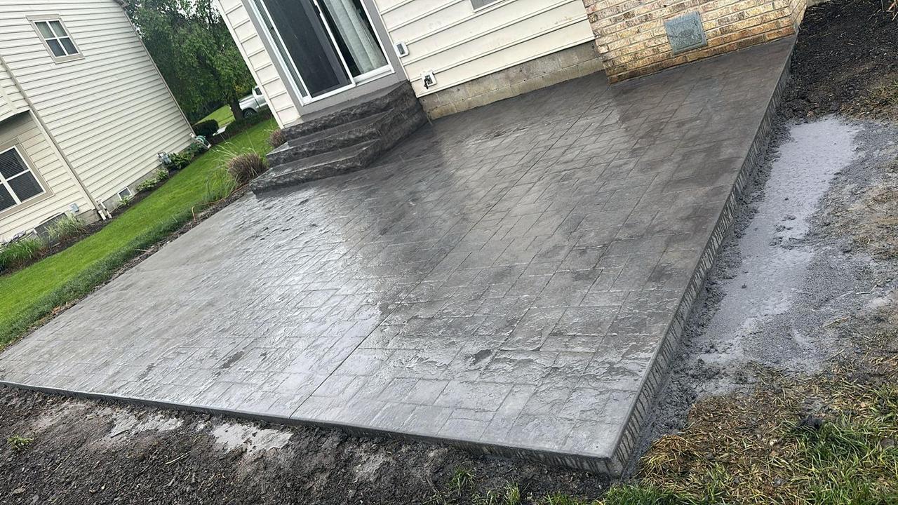Light grey ashlar stamped concrete patio with steps