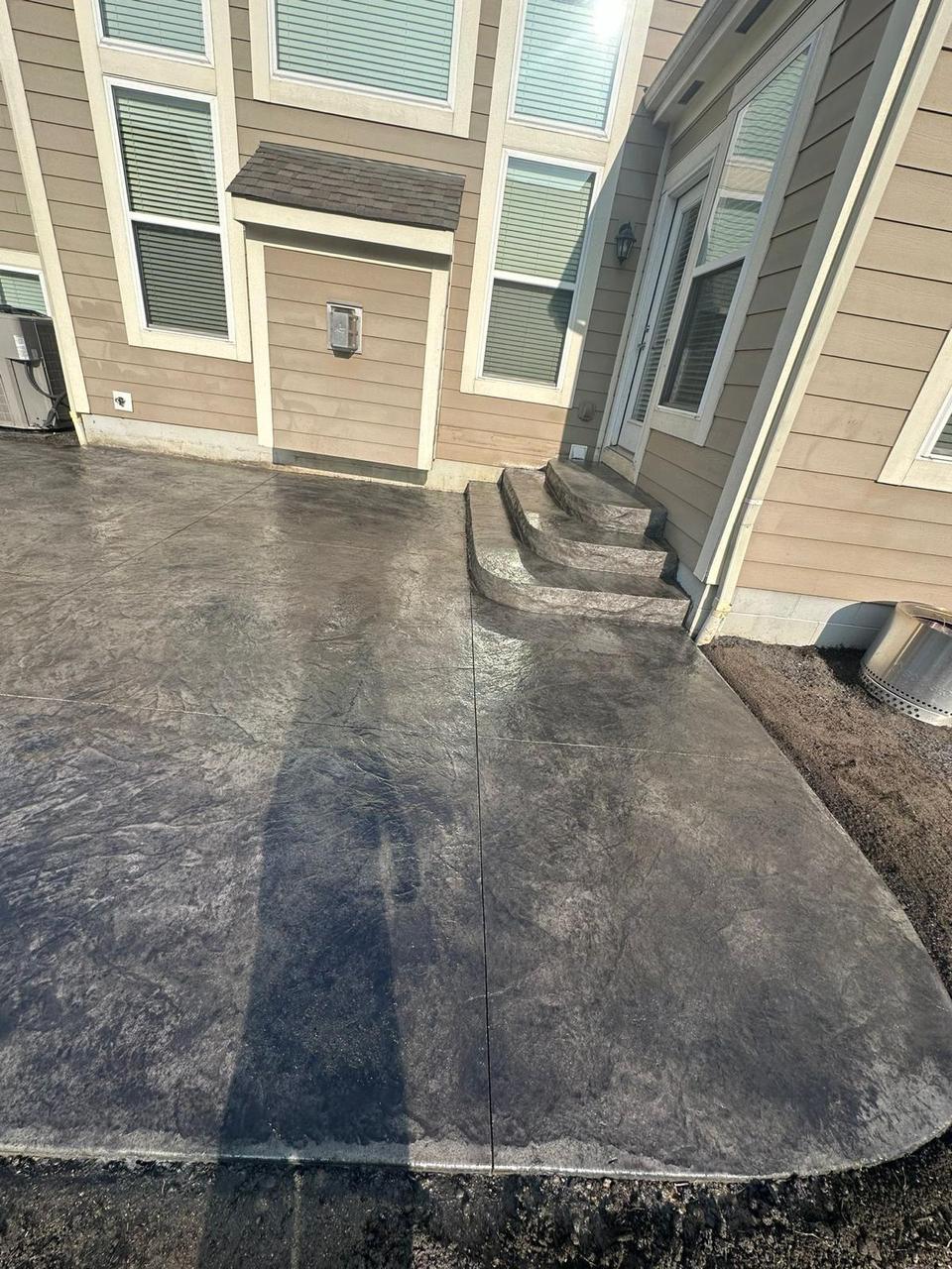 Seamless stamped concrete patio and steps after sealing