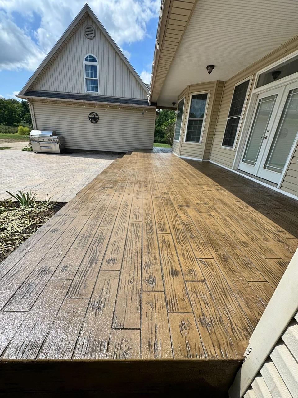 Golden wood plank stamped concrete patio
