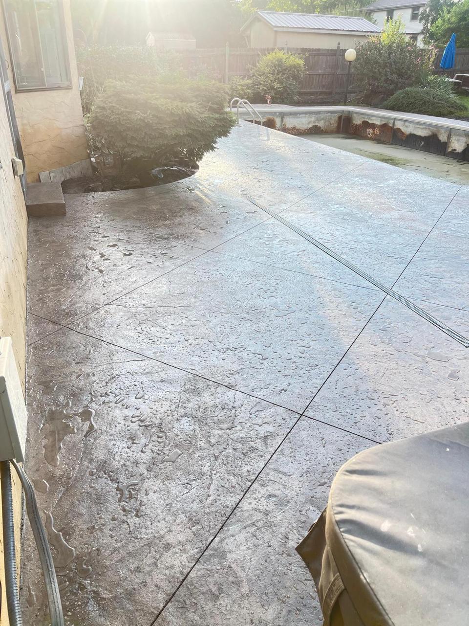Seamless texture stamped concrete pool deck with hot tub pad