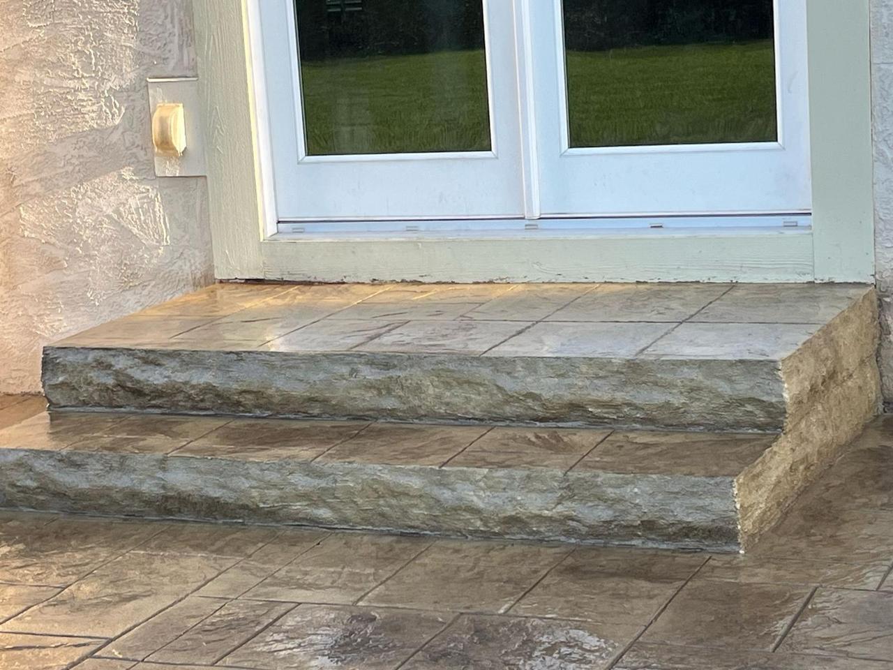Close-up of stamped concrete steps with hand-carved rock-face risers