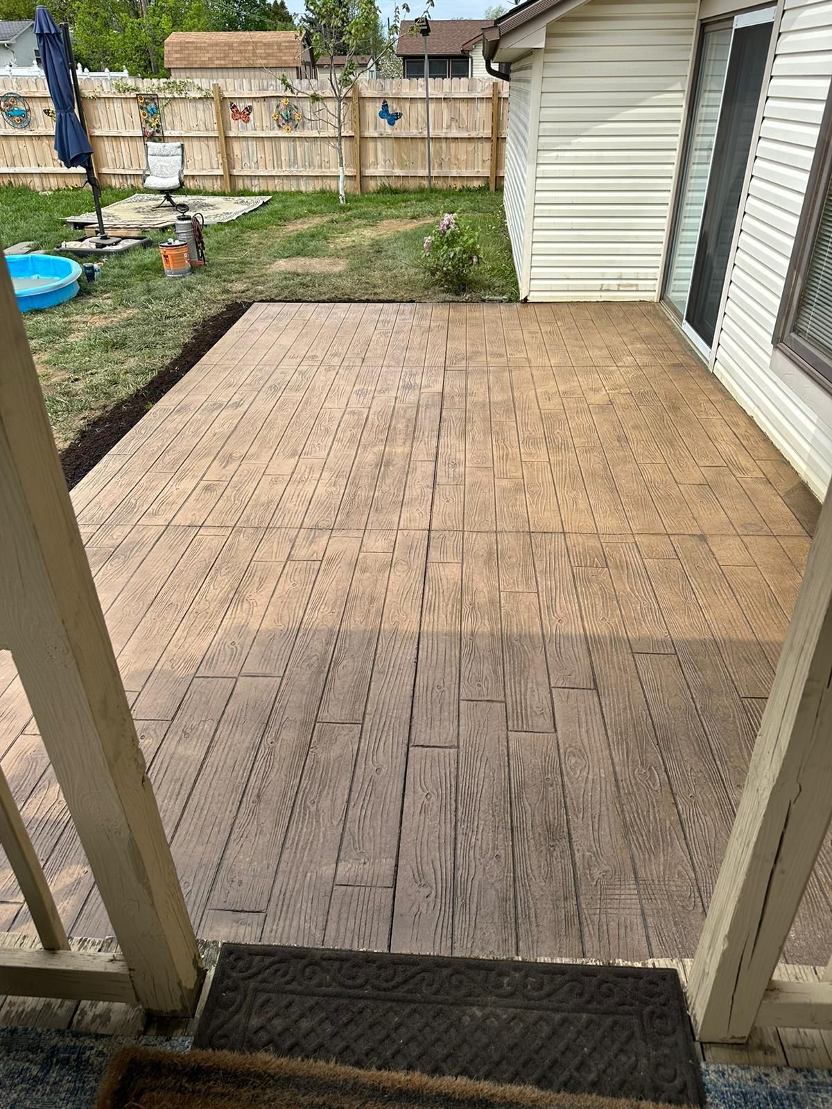 Stamped concrete patio with wood plank finish